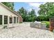 An outdoor kitchen with built in gas grill and stone counter top on a brick paver patio at 6220 E 56Th St, Indianapolis, IN 46226