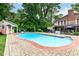 Backyard pool offers a refreshing escape, complete with a pool house and basketball hoop at 6220 E 56Th St, Indianapolis, IN 46226