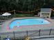 Inviting in-ground pool with surrounding patio, garden, and shed for relaxing summer days and evenings at 6220 E 56Th St, Indianapolis, IN 46226