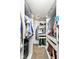 Organized walk-in closet with built-in shelving, drawers, and ample hanging space at 6220 E 56Th St, Indianapolis, IN 46226