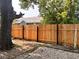 Recently installed privacy fence separates the brick and gravel area in the backyard at 624 N Rural St, Indianapolis, IN 46201