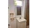 Bathroom with white vanity, mirror, and wall-mounted soap dishes at 624 N Rural St, Indianapolis, IN 46201