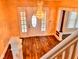 Foyer with a beautiful chandelier, hardwood floors, and staircase leading to the second level at 624 N Rural St, Indianapolis, IN 46201