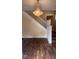 Charming foyer featuring hardwood floors and a staircase with white railings at 624 N Rural St, Indianapolis, IN 46201