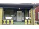 Inviting front porch entrance with decorative ironwork and charming planter boxes at 624 N Rural St, Indianapolis, IN 46201