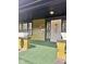 Covered front porch with dark ceilings, green floors, and flower boxes at 624 N Rural St, Indianapolis, IN 46201