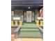 Inviting front porch with green floor, flower boxes, and decorative security door at 624 N Rural St, Indianapolis, IN 46201