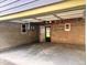 Spacious garage with concrete flooring, block walls, and an entrance to the backyard at 624 N Rural St, Indianapolis, IN 46201
