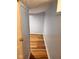 View of a hallway with wood flooring and painted blue walls at 624 N Rural St, Indianapolis, IN 46201