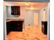 Open-concept kitchen featuring dark wood cabinets, granite countertops, and new appliances at 624 N Rural St, Indianapolis, IN 46201