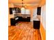 Kitchen features stainless steel appliances, granite countertops, and dark cabinets at 624 N Rural St, Indianapolis, IN 46201