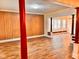 Spacious living room featuring wood floors, built-in bench seating and natural light at 624 N Rural St, Indianapolis, IN 46201