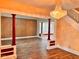 Open living room featuring a decorative chandelier, wood floors, and an open staircase at 624 N Rural St, Indianapolis, IN 46201