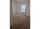 Cozy bedroom featuring neutral carpet, ample natural light from a window, and freshly painted walls at 6368 Titania Dr, Indianapolis, IN 46236