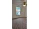 Bedroom featuring neutral paint, carpeting, and a window to provide natural light at 6368 Titania Dr, Indianapolis, IN 46236