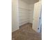 Walk-in closet features wire shelving and neutral carpet at 6368 Titania Dr, Indianapolis, IN 46236