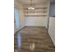 Bright dining area featuring hardwood floors, shelving, and a chandelier at 6368 Titania Dr, Indianapolis, IN 46236