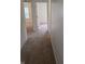 Inviting hallway showcasing plush carpeting, neutral walls, and doorways leading to various rooms at 6368 Titania Dr, Indianapolis, IN 46236