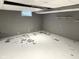 Unfinished basement with painted walls and a blank canvas, perfect for storage or further renovation projects at 6601 Twin Brooks Dr, Indianapolis, IN 46227
