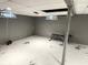 Unfinished basement space showcasing potential for a home gym, with natural light and ample room for customization at 6601 Twin Brooks Dr, Indianapolis, IN 46227