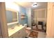 Bathroom with white vanity, toilet, shelves, and unfinished drywall at 6601 Twin Brooks Dr, Indianapolis, IN 46227