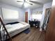 Cozy bedroom with desk and ceiling fan at 6601 Twin Brooks Dr, Indianapolis, IN 46227