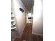Hallway with hardwood floors and access to multiple rooms at 6601 Twin Brooks Dr, Indianapolis, IN 46227
