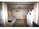 The cozy living room has a couch and a refrigerator at 6601 Twin Brooks Dr, Indianapolis, IN 46227
