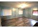 Living room features light blue walls, wood-look floors, and a chandelier at 6601 Twin Brooks Dr, Indianapolis, IN 46227