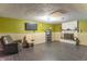 Finished basement featuring fireplace, chairs and tv at 6837 Littleton Dr, Indianapolis, IN 46221
