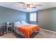 Bedroom with window, ceiling fan, nightstand, and gray carpeting at 6837 Littleton Dr, Indianapolis, IN 46221