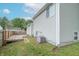 View of the home's exterior, featuring a deck, partial view of the yard and AC Unit at 6837 Littleton Dr, Indianapolis, IN 46221