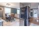 View of the kitchen and eat-in dining area featuring a refrigerator and dining table at 6837 Littleton Dr, Indianapolis, IN 46221