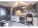 Kitchen featuring stainless steel appliances and a mosaic tile backsplash at 6837 Littleton Dr, Indianapolis, IN 46221