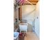 Functional laundry room area with a utility sink, storage and convenient cleaning tools at 6837 Littleton Dr, Indianapolis, IN 46221