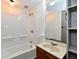 Bathroom featuring a tub and shower combination with a wood vanity at 706 University Blvd, Anderson, IN 46012