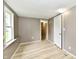 Bedroom featuring vinyl floors, natural light, and closet at 706 University Blvd, Anderson, IN 46012