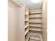 Walk-in closet featuring built-in shelving for ample storage space and organization at 706 University Blvd, Anderson, IN 46012