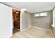 Cozy dining room with light wood floors and neutral-toned walls, open to the kitchen at 706 University Blvd, Anderson, IN 46012