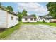 Charming white home with red shutters and a spacious gravel driveway at 706 University Blvd, Anderson, IN 46012