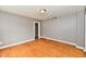 Spacious living room featuring original hardwood floors and neutral paint at 706 University Blvd, Anderson, IN 46012