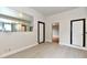 Spacious living area with sleek flooring, neutral walls, and convenient access to kitchen at 706 University Blvd, Anderson, IN 46012