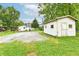 Exterior shed with a gravel driveway and grass yard at 706 University Blvd, Anderson, IN 46012