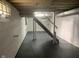 Unfinished basement featuring painted walls, support beams, and concrete flooring at 730 N Riley Ave, Indianapolis, IN 46201