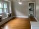 Open-concept living room featuring hardwood floors and built-in cabinets at 730 N Riley Ave, Indianapolis, IN 46201