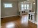 Living room showcasing built-in cabinets, seat and hardwood floors at 730 N Riley Ave, Indianapolis, IN 46201