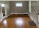 Hardwood floors in a freshly painted living room that is bright and airy at 730 N Riley Ave, Indianapolis, IN 46201