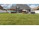 Expansive backyard featuring a pergola, outdoor seating, and a well-maintained lawn at 750 Trillium St, Lebanon, IN 46052