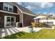 Backyard with patio, outdoor dining set, grill, and hot tub at 750 Trillium St, Lebanon, IN 46052