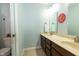 Bathroom featuring double vanity with undermount sinks, wooden cabinetry, and decorative mirrors at 750 Trillium St, Lebanon, IN 46052